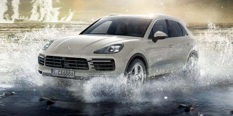 The 2023 Porsche Cayenne Coupe splashing through water